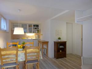 a kitchen and dining room with a table and chairs at Apartment Helene Apt- Hella by Interhome in Wengen +13 photos