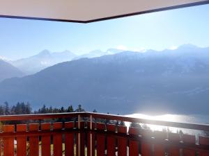 a balcony with a view of the mountains at Apartment Berg-Seeblick by Interhome in Sundlauenen