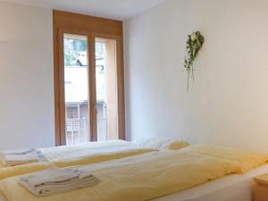 Postel nebo postele na pokoji v ubytování Apartment Eden Apt-D by Interhome