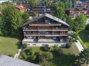 an aerial view of a large house in a city at Apartment Centaure A RS 3 by Interhome in Ovronnaz