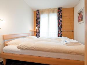 Postel nebo postele na pokoji v ubytování Apartment Silberhorn Apt- DW by Interhome