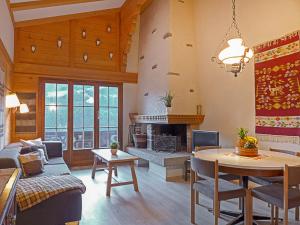 a living room with a couch and a table at Apartment Bergkristall by Interhome in Wengen