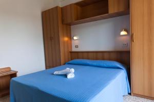 Postel nebo postele na pokoji v ubytování Hotel Singapore