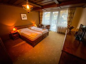 Ένα ή περισσότερα κρεβάτια σε δωμάτιο στο Horsky Hotel Encian Donovaly