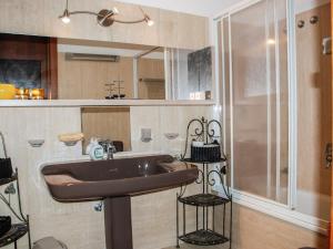 a bathroom with a sink and a shower at Apartment Vista San Salvatore by Interhome in Lugano