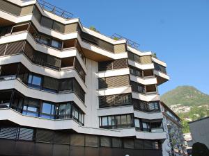 a building with balconies on the side of it at Apartment Vista San Salvatore by Interhome in Lugano