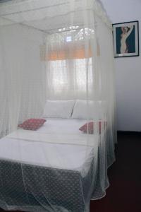 Cama o camas de una habitación en Malsha Villa