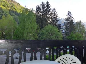 a balcony with a fence with a view of a mountain at Apartment Le Triolet-5 by Interhome in Chamonix