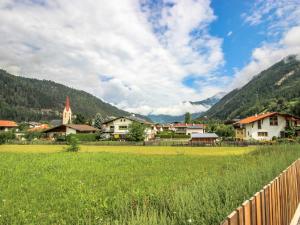 a village with a fence and a green field at Apartment Matilda by Interhome in Ried im Oberinntal