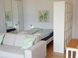 Ένα ή περισσότερα κρεβάτια σε δωμάτιο στο Studio Miramonti by Interhome