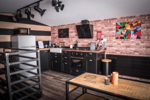 Kuchyň nebo kuchyňský kout v ubytování L'écurie gîte duplex Welness