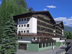 a large building with balconies on the side of it at Apartment Top 49 by Interhome in Heiligenblut