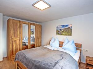 A bed or beds in a room at Apartment Renauer by Interhome