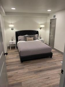 A bed or beds in a room at Main Street Farmhouse City Retreat by Hollyhock