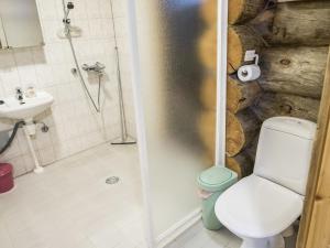 a bathroom with a shower and a toilet and a sink at Holiday Home Kelovalta 7b by Interhome in Ruka