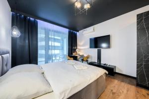 Łóżko lub łóżka w pokoju w obiekcie Kazou Residence Arkadia