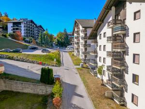 a view from the balcony of a apartment building at Apartment Genets 150 D by Interhome in Nendaz