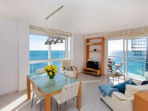 a living room with a glass table and a couch at Apartment Gala I-1 by Interhome in Miami Platja