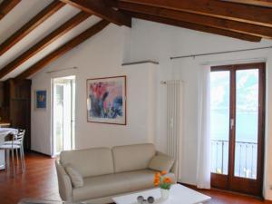 a living room with a couch and a table at Apartment Busbai by Interhome in Ronco sopra Ascona