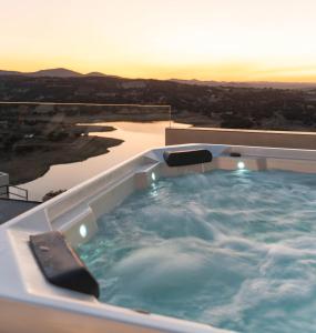 a hot tub on the roof of a house with a view at Hoteles Desconecta2 in Monesterio