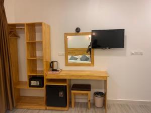 A television and/or entertainment centre at Sky View by Relax Tours