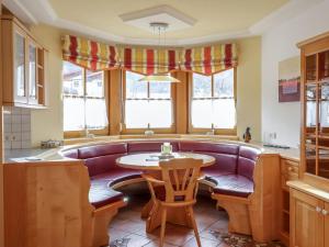 a living room with a couch and a table at Apartment Ennstal by Interhome in Radstadt