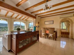a large living room with a table and a couch at Holiday Home Isabelle by Interhome in Jávea +36 photos