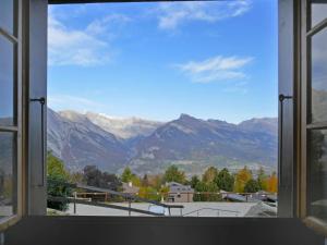 a window with a view of the mountains at Chalet Chalets Tsamandon by Interhome in Nendaz