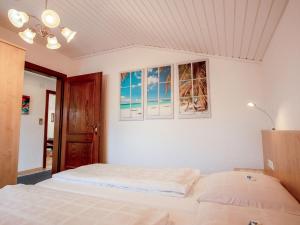 A bed or beds in a room at Apartment Zander by Interhome