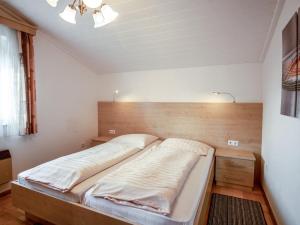 A bed or beds in a room at Apartment Zander by Interhome