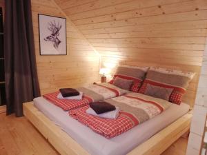 Postel nebo postele na pokoji v ubytování Chalet Hütte Buchfink by Interhome