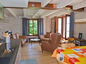 a living room with a couch and a table at Chalet Chalet la Frêtaz by Interhome in Bullet