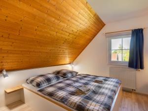 Ένα ή περισσότερα κρεβάτια σε δωμάτιο στο Holiday Home Holiday Hill 58 by Interhome