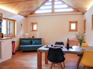 a living room with a table and a couch at Holiday Home Rustico Rudico by Interhome in Semione