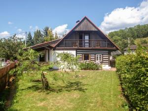 a house with a large yard in front of it at Holiday Home Lánov by Interhome in Horní Lánov