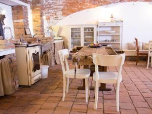 a kitchen with a table and chairs and a stove at Apartment Zábřeh-Lukavice 2 by Interhome in Zábřeh