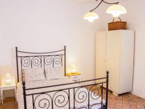 a bedroom with a black bed and a white refrigerator at Apartment Zábřeh-Lukavice 2 by Interhome in Zábřeh +32 photos