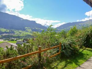 a view of a mountain with a wooden fence at Apartment Muotta Sulegl by Interhome in Schleuis