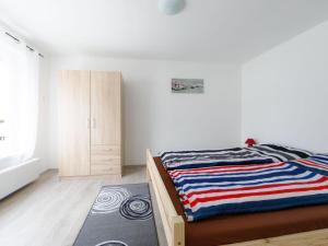 A bed or beds in a room at Holiday Home Cherry by Interhome