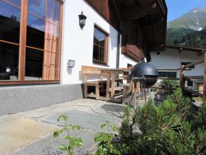 a grill on the side of a house at Chalet Chalet Alois by Interhome in Juns