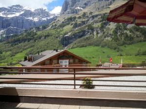 a cabin in the mountains with a green valley at Apartment Ringstrasse - Utoring-24 by Interhome in Leukerbad