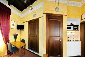 a kitchen and a dining room with a table at Vantaggio in Rome