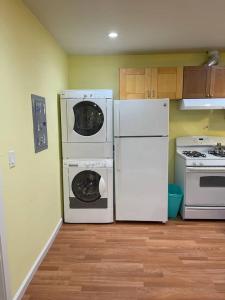 a kitchen with two refrigerators and a stove at Warm and Comfy Antioch Cottage, close to everything in Antioch