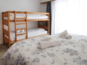 Ένα ή περισσότερα κρεβάτια σε δωμάτιο στο Apartment Derborence 28 by Interhome +30 φωτογραφίες