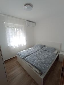 Кровать или кровати в номере Relax Apartment