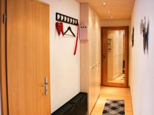 a hallway with a door leading to a room at Apartment Grande-Ourse 2 pièces 1027 by Interhome in Moleson