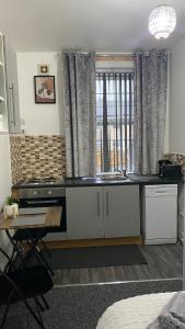 a kitchen with a sink and a counter top at BVapartments-Blackhouse F2 in Huddersfield