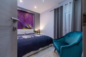 Posteľ alebo postele v izbe v ubytovaní Apartments Villa Pupa