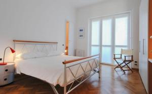 A bed or beds in a room at Conca Del Naviglio by Halldis