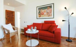 A seating area at Conca Del Naviglio by Halldis